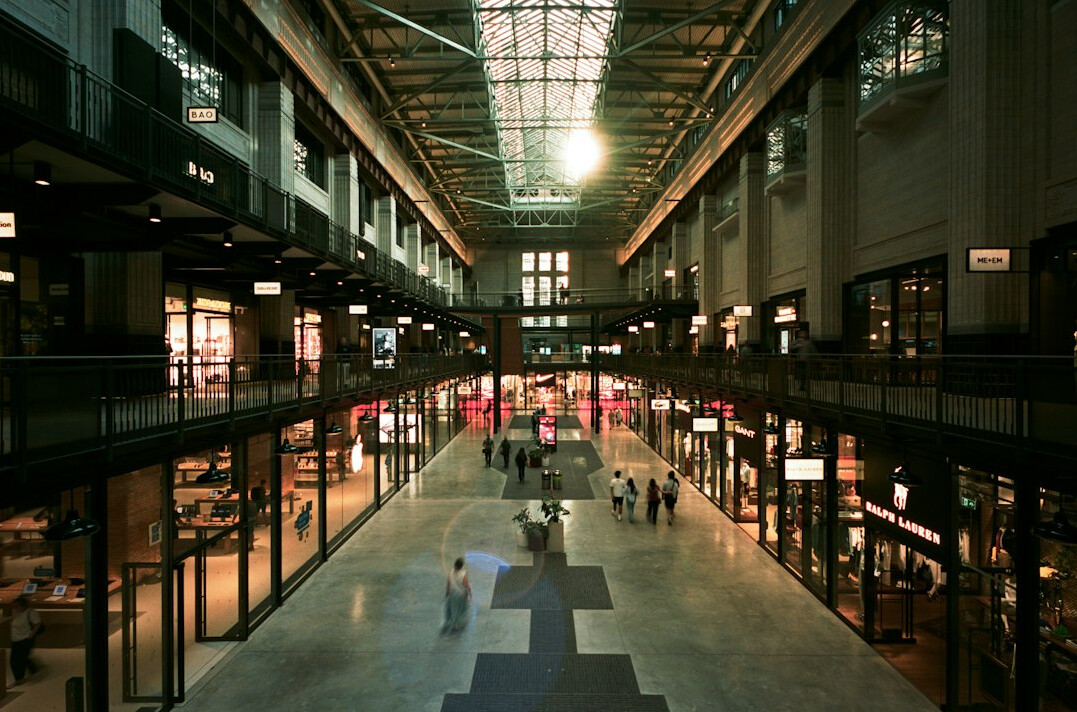 Spacious shopping mall hall with natural light